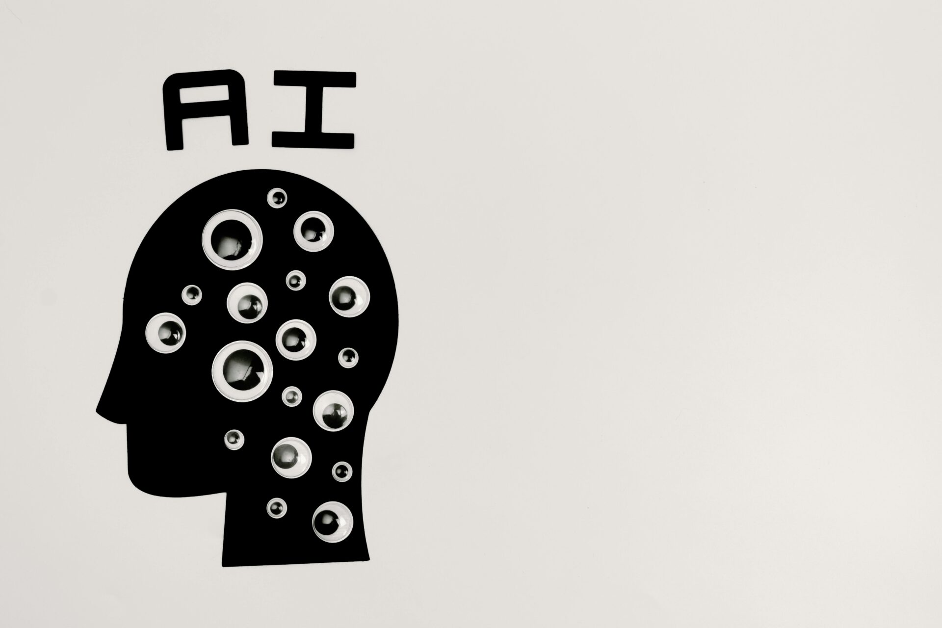 AI letters on top of silhouette of head